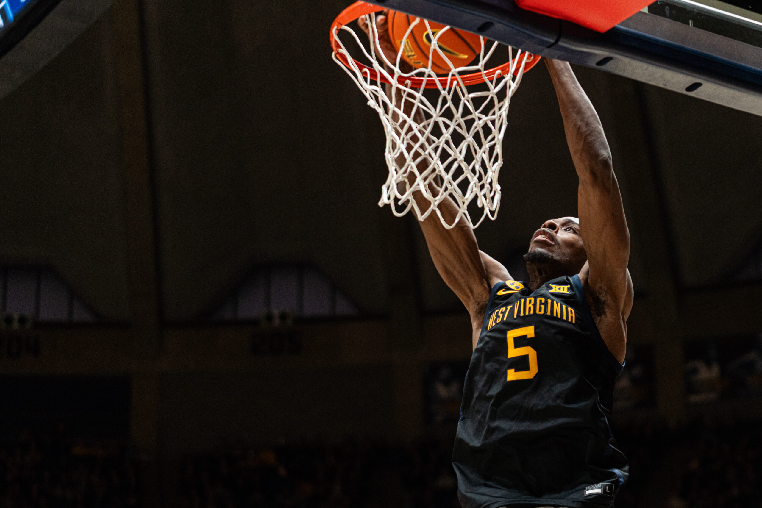 Toby Okani's attention to detail leads WVU past Utah 72-61